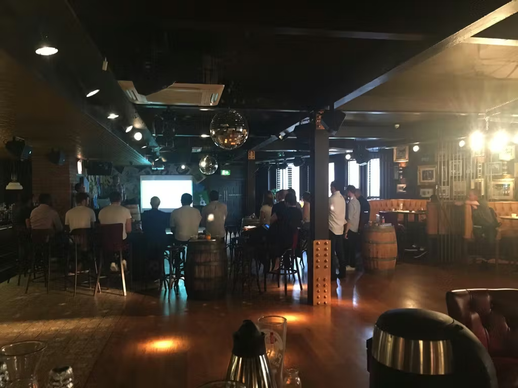 team sitting in the bar